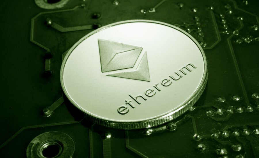 Close-up photo of a coin with ethereum's name and logo.