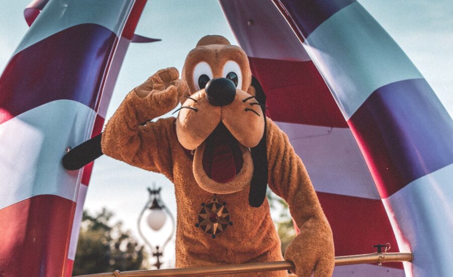 A person is in a dog suit is seen posing