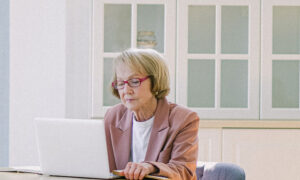 A woman working on her computer