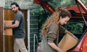 A couple unpack boxes at their new home in Toronto