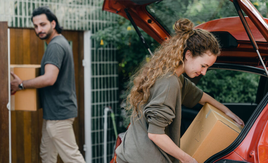 A couple unpack boxes at their new home in Toronto