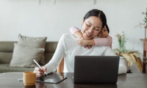 A mother looks at her mortgage options online