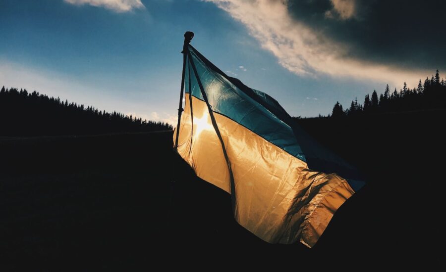 A flag is seen flying over a hroizion