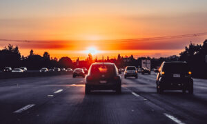 A car on a highway at sunset