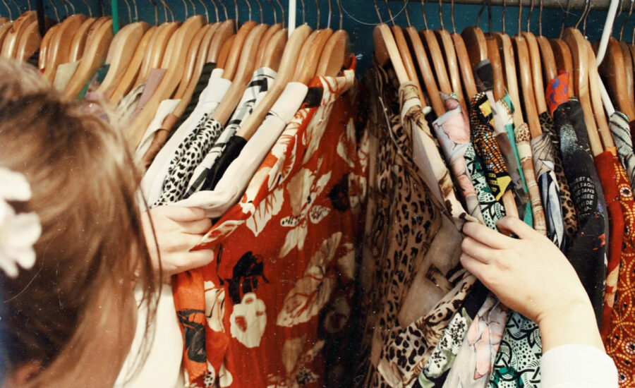 A woman scans her dress collection