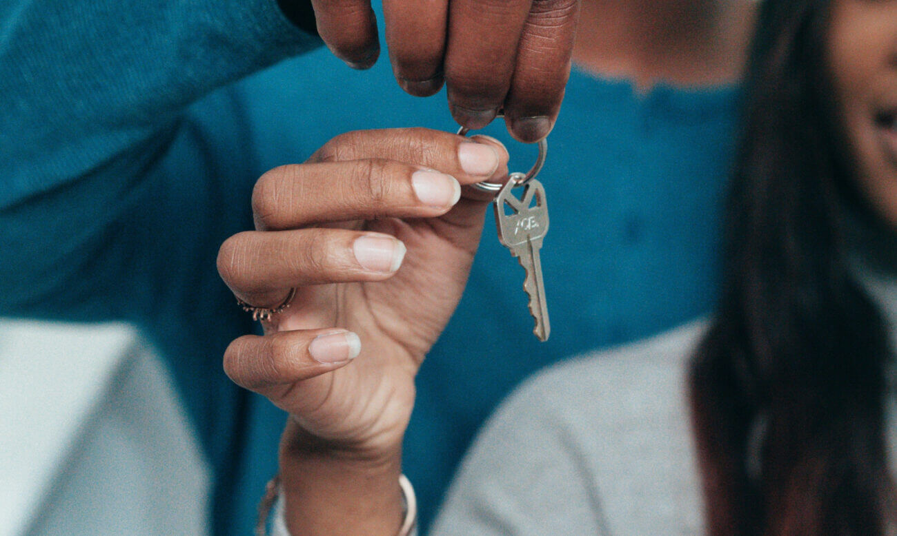 A couple hold the keys to their new home