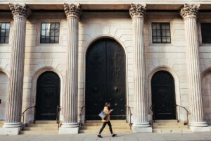 woman walking by bank