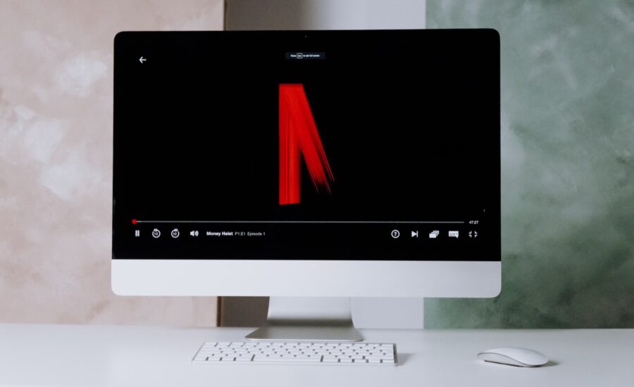 A photo of the faded out netflix logo is seen on a screen