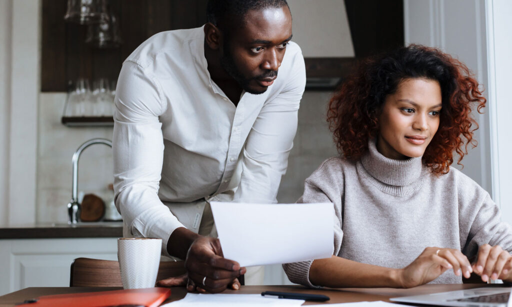 A couple looking at the Best Canadian ETFs list