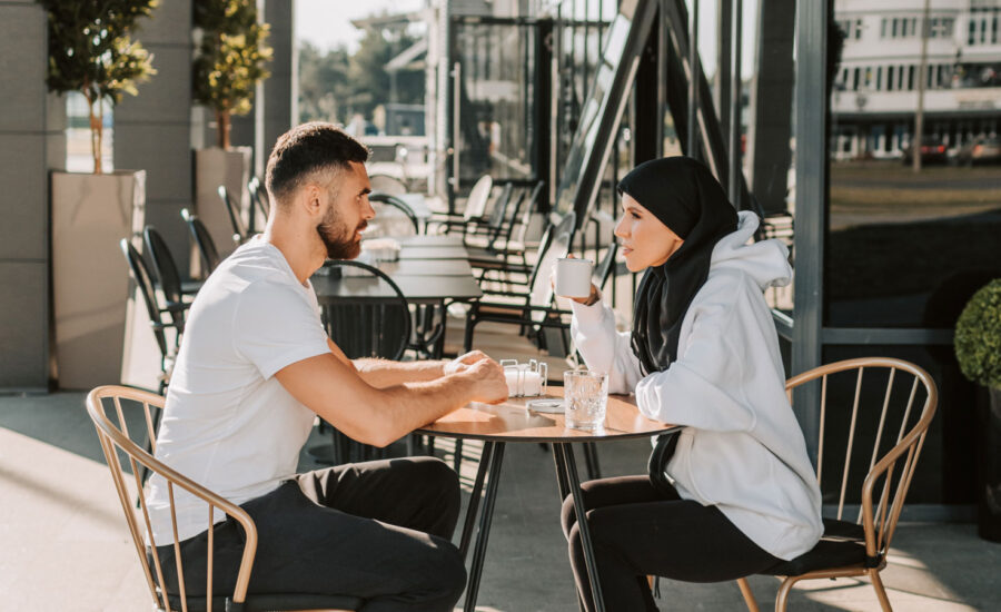 A couple sits down at a cafe to discuss their investments