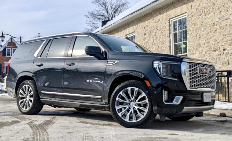 A GMC Yukon Denali sport utility vehicle on a driveway