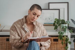 short-haired-woman-does-paper-work-in-apartment