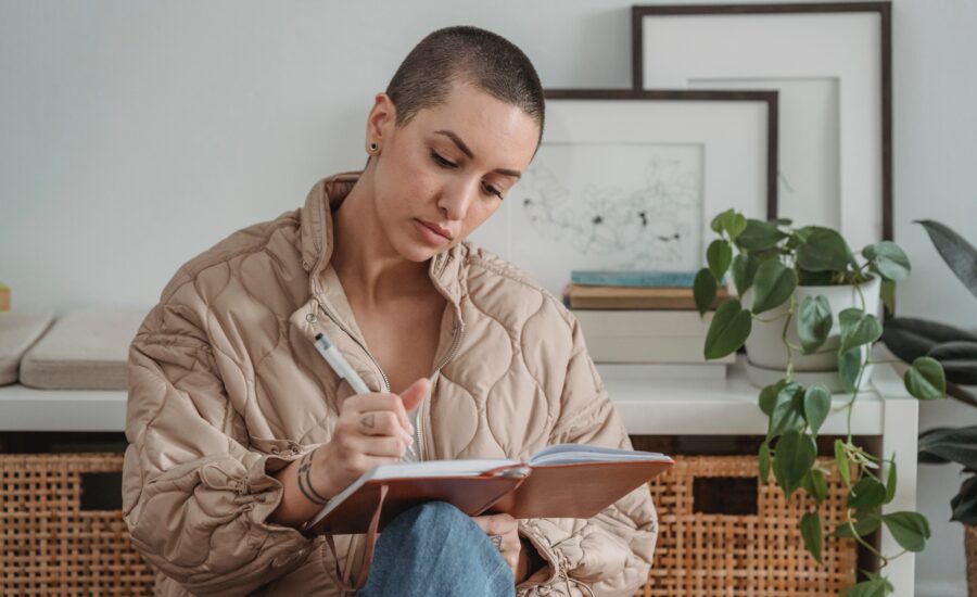 short-haired-woman-does-paper-work-in-apartment