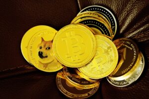 A pile of gold coins with bitcoin and other crypto logos