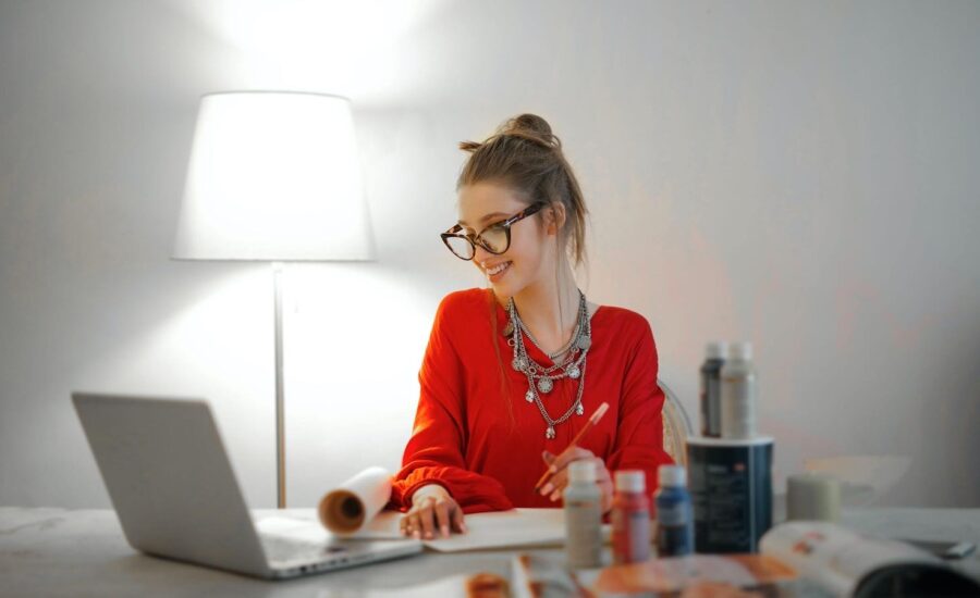 A woman has a simile across her face after making her first transaction with an online broker
