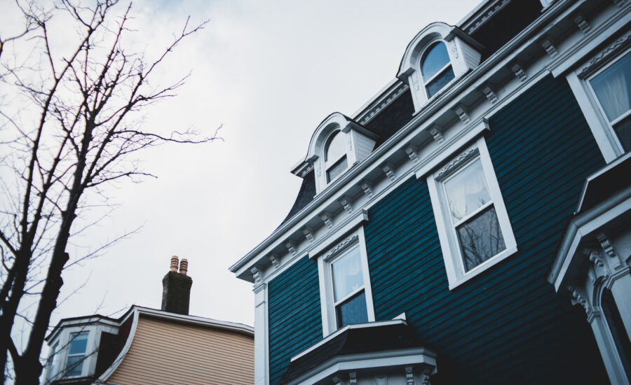 Exterior view of the upper floor of a home on a cloudy fall day