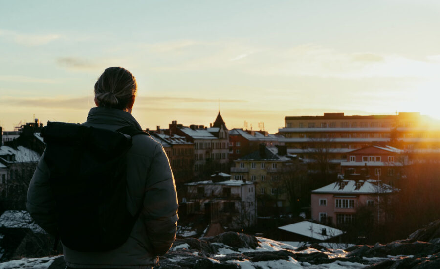 A man is looking over the city of Stockholm, Sweden, wondering about his investing options as a non-resident of Canada.