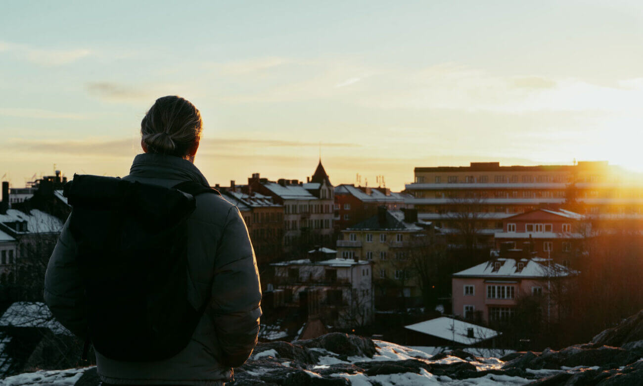 A man is looking over the city of Stockholm, Sweden, wondering about his investing options as a non-resident of Canada.