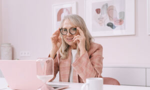 Photo of a woman reading the Franklin Templeton Annual Returns of Key Asset Classes for Canadian investors.