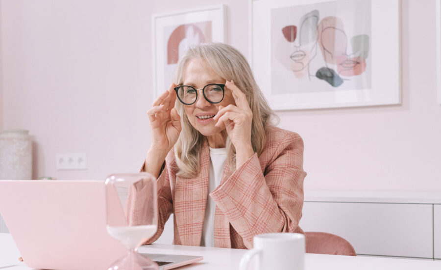 Photo of a woman reading the Franklin Templeton Annual Returns of Key Asset Classes for Canadian investors.