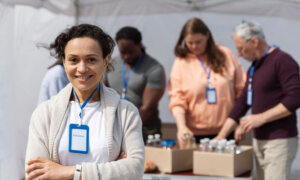 Volunteers at a food bank smiling