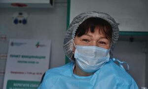 A 55-year-old nurse smiles as she contemplates her five or 10 year retirement plan.