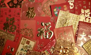 An assortment of red and gold Lunar New Year envelopes
