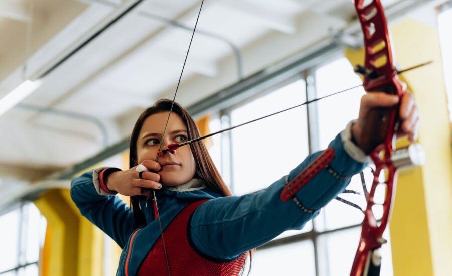 An archer with her eye on the target to symbolize Target Date Funds in Canada.