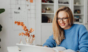 A woman reviews RRSP rules on her computer ahead of the contribution deadline