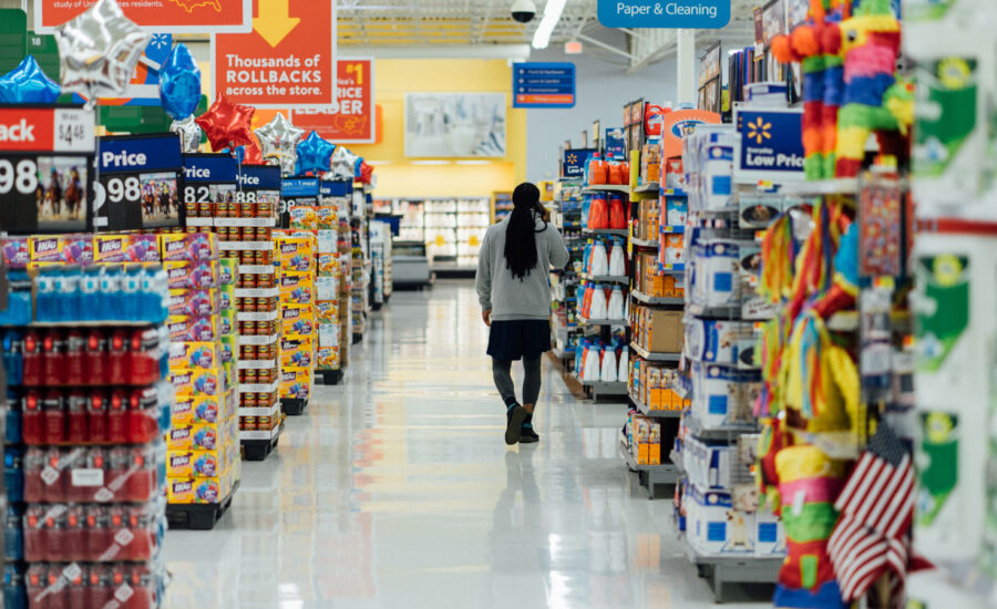 A woman walks along the grocery store aisles, as we discuss inflation, including on groceries.