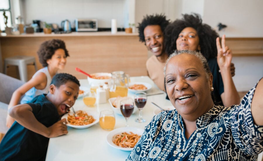 A retiree with her adult child's own family at their first home, thanks to the FHSA