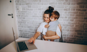 A mom and her child calculating the contribution room of her TFSA.