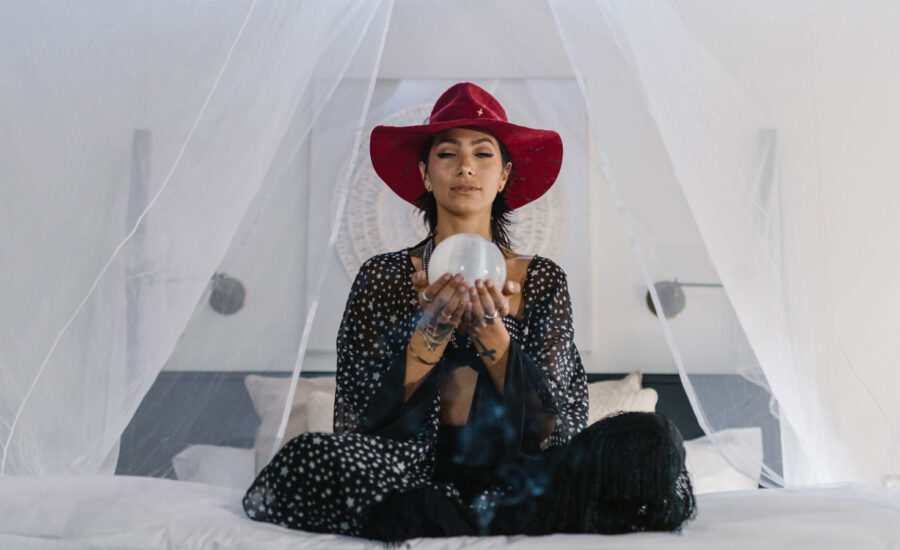 A woman holds a crystal ball, as we look at the Bank of Canada inflation predictions.