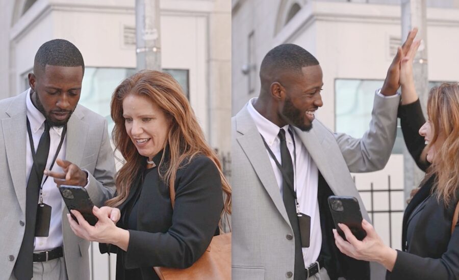 A couple looking at their phone and then at each other as a reaction to the new site.