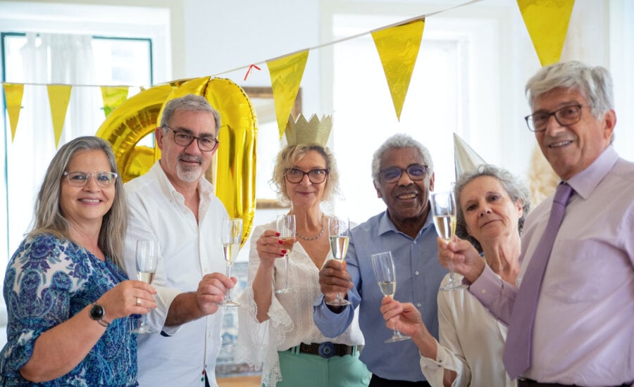 Six people celebrating retirement, symbolizing the five (plus one) factor for when to retire in Canada