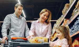 A family shopping for groceries, amidst food inflation as well as housing.