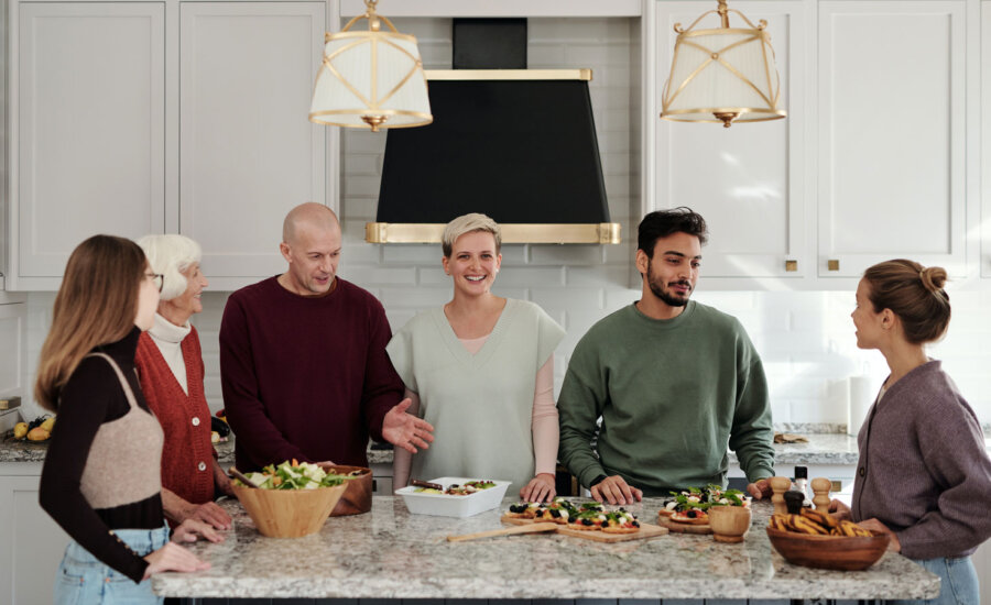 A Canadian family in the kitchen talking about wills and estate planning.