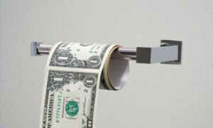 U.S. dollar bill on a toilet paper roll to symbolize the effects of inflation