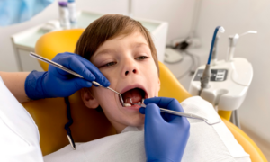 A young boy gets a dental cleaning