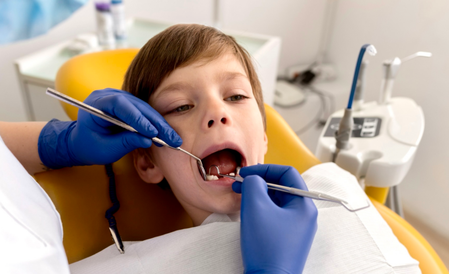 A young boy gets a dental cleaning