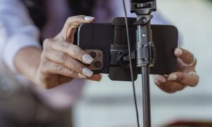 A personal finance influencer sets up her camera to shoot a segment