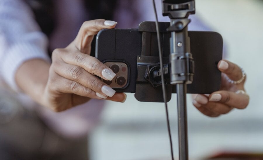 A personal finance influencer sets up her camera to shoot a segment