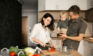 Family cooking together, trying to not waste food and keep grocery costs down.