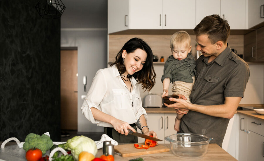 Family cooking together, trying to not waste food and keep grocery costs down.