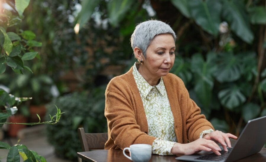 A woman reviews tax information online after receiving a severance payment