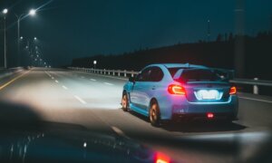 A stolen car speeds off into the distance in the middle of the night