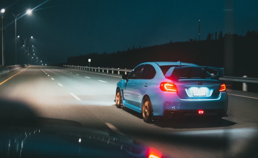 A stolen car speeds off into the distance in the middle of the night