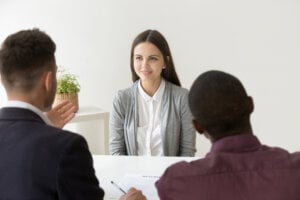 A woman prepares for an interview after experiencing job loss in Canada.