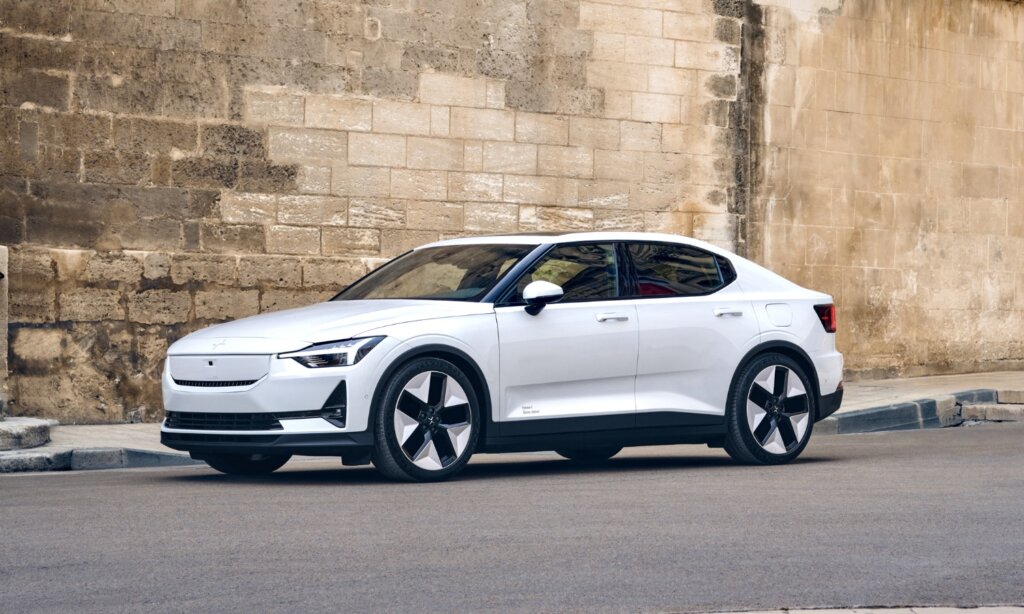 A white Polestar 2 on a city street