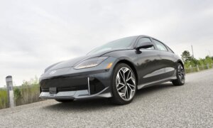 A black Ioniq 6 sedan sits on a street